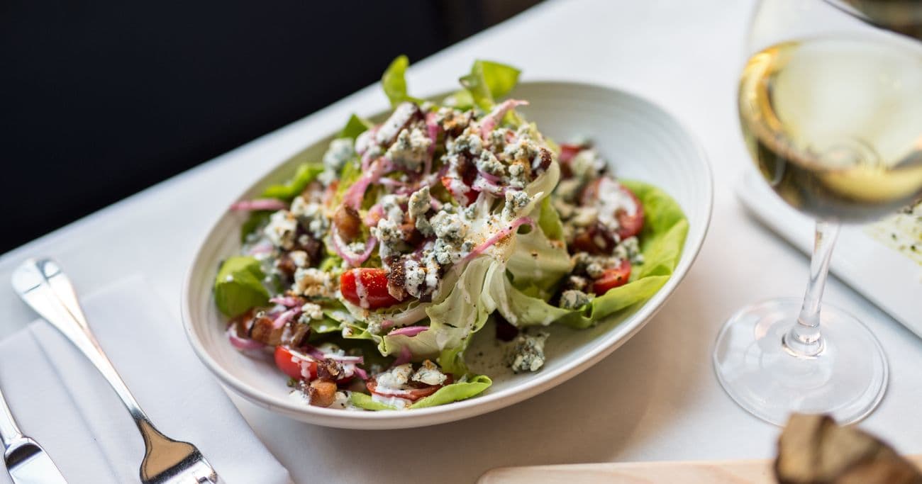 Plate a salad and glass of wine